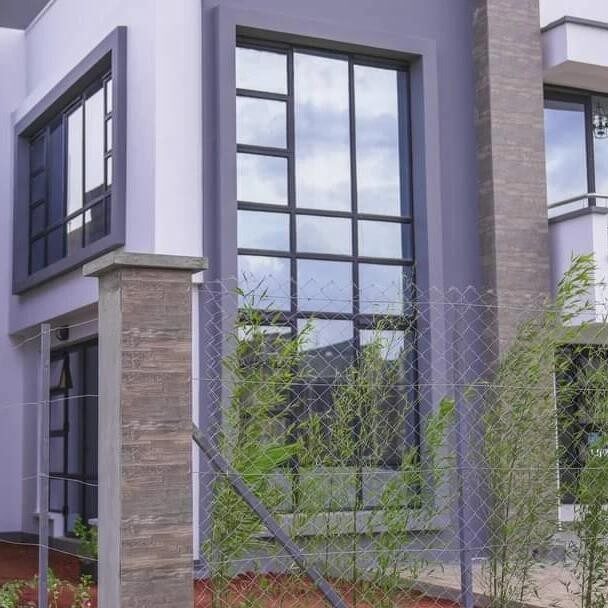 Stone-textured pillars and glazing on the Kenyatta Road maisonette